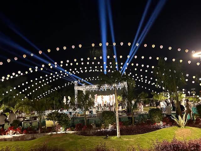 Elegant wedding venue decoration with drapes and lighting in Gujarat